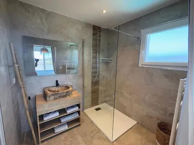 a bathroom with a shower and a sink at Villa Oletta, Saint Florent in Oletta