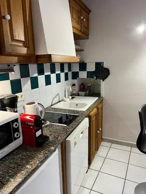 a kitchen with a sink and a counter top at Appartement centre historique Ajaccio in Ajaccio