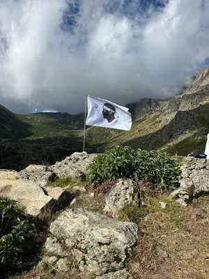 a white flag sitting on top of a mountain at Casa Bella Centre de Corsica in Corte