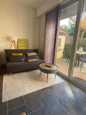 a living room with a couch and a coffee table at Cozy cocoon 300m de la plage in Borgo