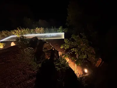 an overhead view of a bench at night at Villa neuve d'exception 6ch SPA Piscine in Conca