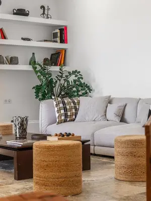 a living room with a couch and a table at Magnifique villa 6 chambres avec piscine,Olmeto plage in Olmeto