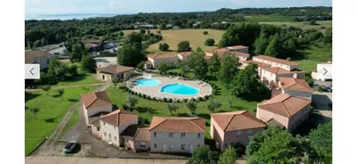 an aerial view of a house with a swimming pool at Mini villa Corse in Santa-Maria-Poggio