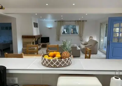 a bowl of fruit on a counter in a living room at A Filetta, Maquis & mer, dans un hameau de charme in Sartène