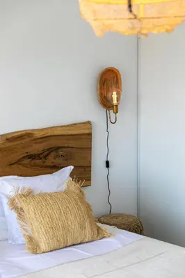 a bedroom with a bed with a pillow and a lamp at Villa Margaux with private pool & sea view in Conca