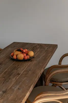a plate of fruit on a wooden table at Villa Margaux with private pool & sea view in Conca