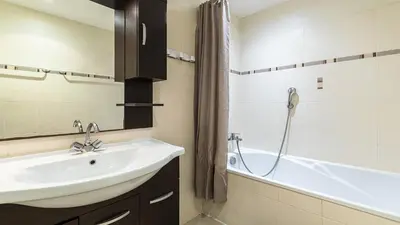 a bathroom with a sink and a bath tub at Lisa Maria D N38 2P5 in Sari Solenzara