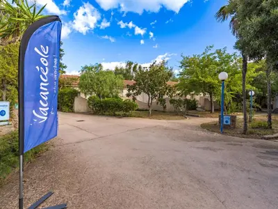 a blue sign in front of a house at Lisa Maria E N60 3P7 in Sari Solenzara