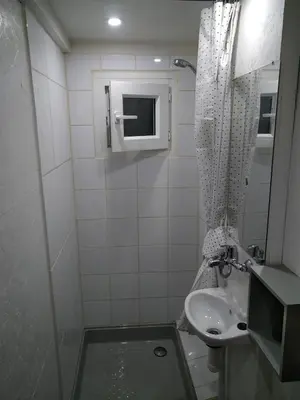 a small bathroom with a sink and a toilet at Gîte nature sous les châtaigniers in Zonza