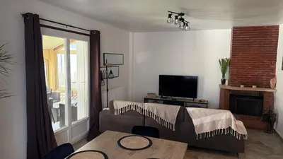 a living room with a bed and a table at Mare è Muntagna in Mignataja