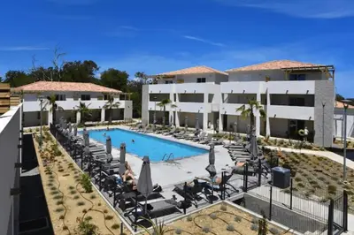 an aerial view of a resort with a swimming pool at Corsica Beach, Paddleboarding, Pool & Hiking J159 in Linguizzetta