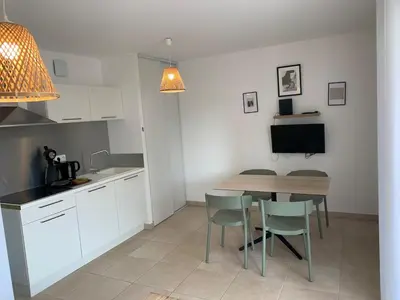 a kitchen and dining room with a table and chairs at Corsica Beach, Paddleboarding, Pool & Hiking J159 in Linguizzetta