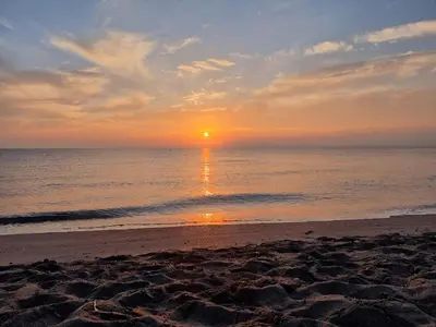 a sunset on a beach with the ocean at Corsica Beach, Paddleboarding, Pool & Hiking J159 in Linguizzetta