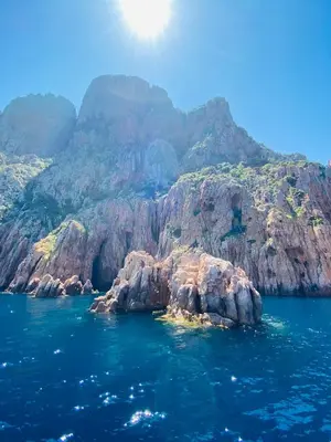 a view of a rocky island in the water at Petit cocon près des Calanques de Piana in Porto Ota