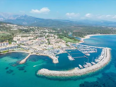 an aerial view of a harbor with boats in the water at Appartement pieds dans l'eau sur Port de Plaisance in Sari Solenzara