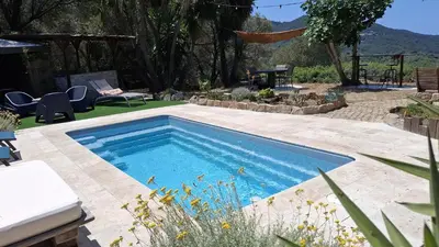 a swimming pool in the middle of a yard at A Casa Faggia in Sollacaro
