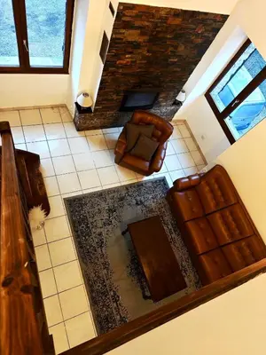 an overhead view of a living room with a couch at Appartement charmant - Entre campagne et ville in Corte
