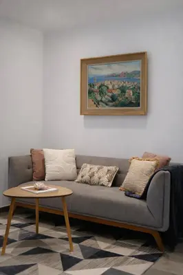 a living room with a couch and a table at Résidence A Stella in Piana
