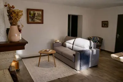 a living room with a couch and a table at Résidence A Stella in Piana