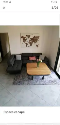 a living room with a coffee table and a couch at Horizon bleu in Ventiseri