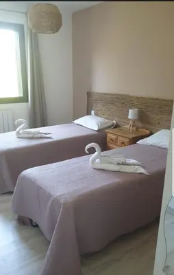 a bedroom with two beds and a window at Horizon bleu in Ventiseri