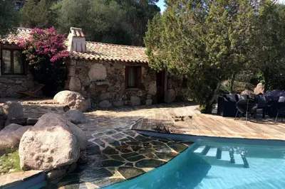 a house with a swimming pool in a yard at Charming villa # Petra's House in Palombaggia in Porto-Vecchio