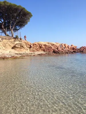 a group of people standing on a beach near the water at Charming villa # Petra's House in Palombaggia in Porto-Vecchio