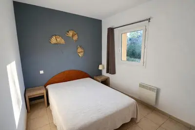 a bedroom with a white bed and a window at Appartement 4 personnes - Soléa 137 - Vue Mer in Serra-di-Ferro