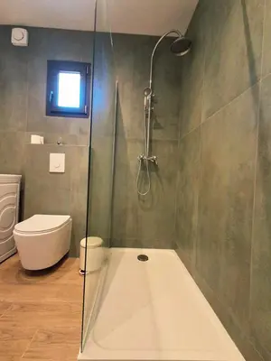a bathroom with a shower and a toilet at Lumineux studio entre terre et mer à 2min de la plage in Calcatoggio