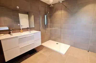 a bathroom with a white sink and a shower at Charming setting with private pool in Cala Rossa in Lecci