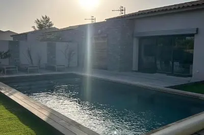 a swimming pool with a fountain in a house at Charming setting with private pool in Cala Rossa in Lecci