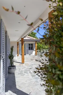 a mirror on a wall next to a table at Villa Golfe Favone Corsica 10P Pool Sea View in Sari Solenzara