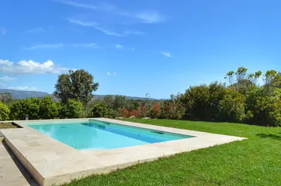a swimming pool in the middle of a yard at Villa Serena - 10mn de la plage in Bonifacio