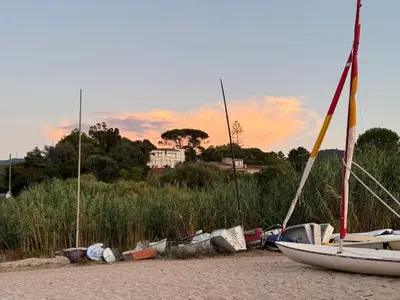 a group of boats sitting on the beach at Villa Solanella in Coti-Chiavari