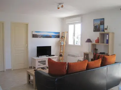 a living room with a couch and a television at Villa sur Travo , Solenzara in Vaccili
