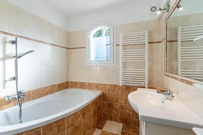 a bathroom with a tub and a sink at Villa Maria Magdalena - Avec piscine in Sari Solenzara