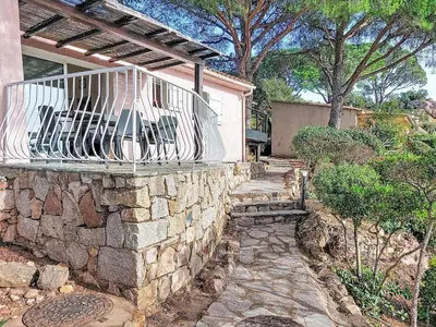 a stone wall with a bench on top of it at Apartment Marina Di Santa Giulia by Interhome in Porto-Vecchio