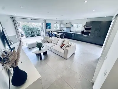 a glass door leading to a patio with a table and chairs at Villa with pool near Porto-Vecchio beaches in Porto-Vecchio