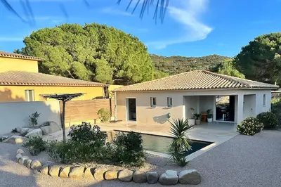a house with a swimming pool in a yard at Villa with pool near Porto-Vecchio beaches in Porto-Vecchio