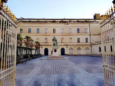 a building with a statue in the middle of a courtyard at T2 hyper centre ville in Ajaccio