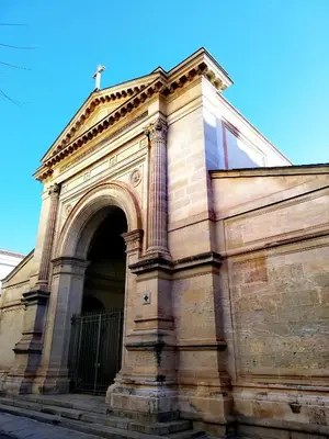a building with an arch on the side of it at T2 hyper centre ville in Ajaccio