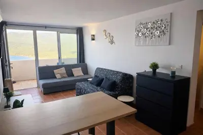 a living room with a couch and a table at Appartement 4 personnes - Soléa 229 - Vue Mer in Serra-di-Ferro