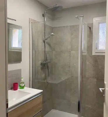 a bathroom with a shower and a sink at Cozy villa with pool in Eccica-Suarella