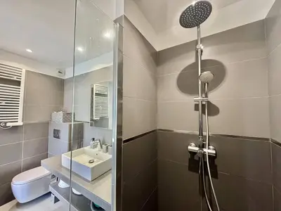 a bathroom with a shower and a sink at T2 à 200m des plages in Propriano