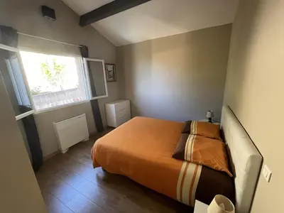 a bedroom with a bed and a window at A Casa di Natalina in Piana