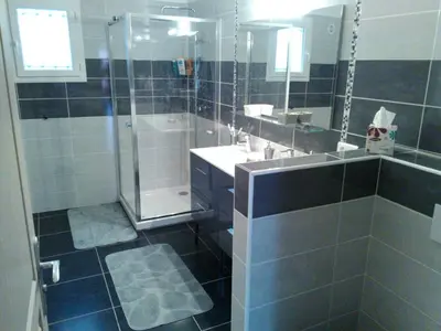 a bathroom with a shower and a sink and a mirror at A Casa di Natalina in Piana