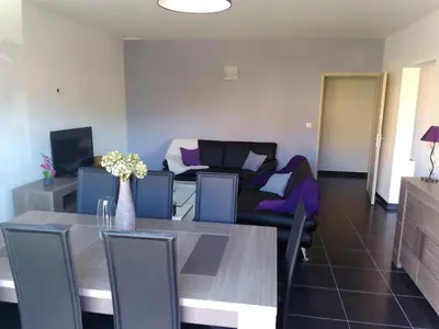 a living room with a table and a couch at A Casa di Natalina in Piana