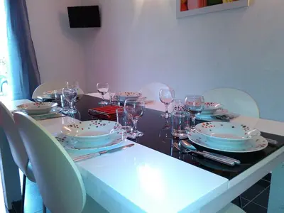 a table with plates and wine glasses on it at A Casa di Natalina in Piana