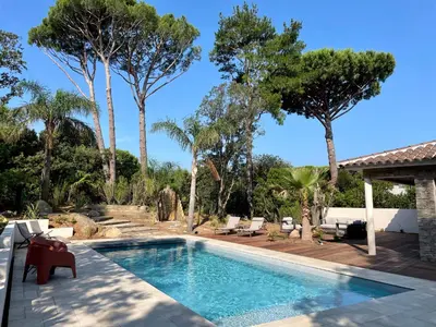 a swimming pool in a yard with trees at Villa Mare e Monte - Cala Rossa in Porto-Vecchio