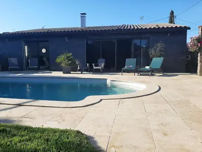 a swimming pool in front of a house at Villa LICCIA in Prunelli-di-Fiumorbo